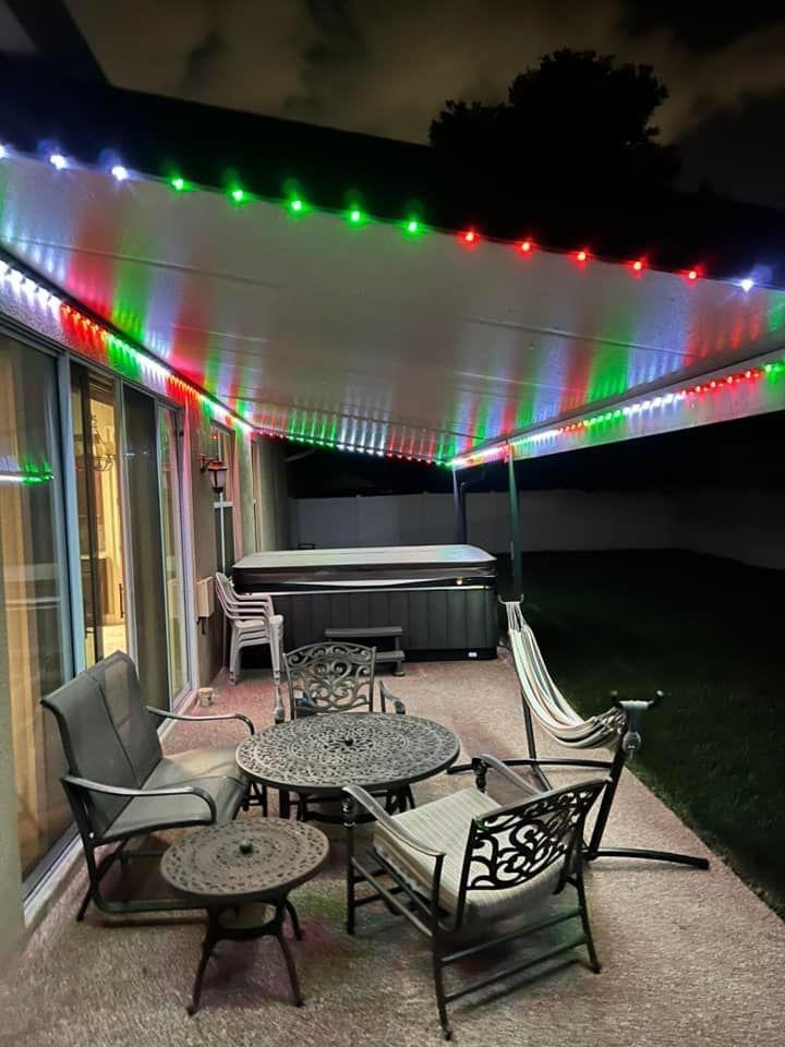 Outdoor dining area with globe lights above table